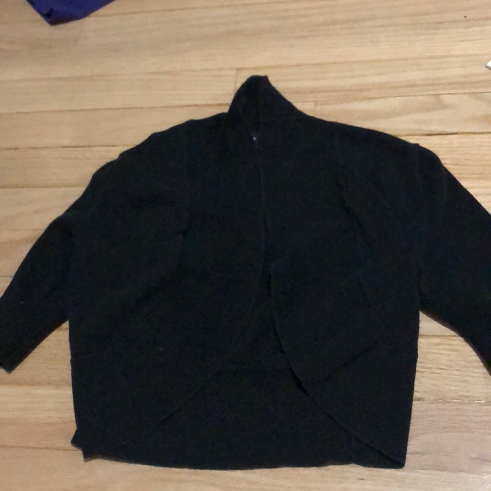 A white T-shirt and a small black cardigan